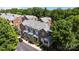 Aerial view of a brick townhome complex surrounded by lush trees at 4941 S Hill View Dr, Charlotte, NC 28210