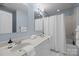 Bright bathroom with double sinks, white countertops, and a shower/tub combo at 4941 S Hill View Dr, Charlotte, NC 28210