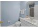 Charming bathroom with a white vanity, matching toilet, a framed mirror, and a shower featuring glass doors at 4941 S Hill View Dr, Charlotte, NC 28210
