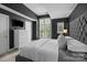 Stylish bedroom featuring dark walls, white trim, and a luxurious upholstered headboard at 4941 S Hill View Dr, Charlotte, NC 28210