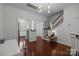 Hardwood floors, staircase, and dining area with view of the kitchen at 4941 S Hill View Dr, Charlotte, NC 28210