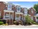 Charming red brick townhomes with inviting front porches and professional landscaping at 4941 S Hill View Dr, Charlotte, NC 28210