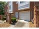 Brick townhome with garage and well-maintained landscaping at 4941 S Hill View Dr, Charlotte, NC 28210