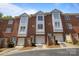 Brick townhome complex with attached garages and well-maintained landscaping at 4941 S Hill View Dr, Charlotte, NC 28210