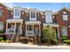 Charming red brick townhomes with inviting front porches and professional landscaping at 4941 S Hill View Dr, Charlotte, NC 28210