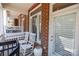 Charming front porch with white rocking chairs, brick walls, and a welcoming entrance at 4941 S Hill View Dr, Charlotte, NC 28210