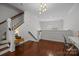 Hardwood floors, staircase, and second story loft space at 4941 S Hill View Dr, Charlotte, NC 28210
