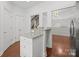 Kitchen island features granite countertops, white cabinets, and a convenient bar for entertaining and additional seating at 4941 S Hill View Dr, Charlotte, NC 28210
