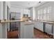 Modern kitchen featuring stainless steel appliances, granite countertops, white cabinets, and a convenient island feature at 4941 S Hill View Dr, Charlotte, NC 28210