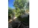 View of the brick patio and landscaped backyard from a wooden staircase at 500 W Council St, Salisbury, NC 28144