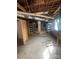 Unfinished basement with exposed brick columns and shelving at 500 W Council St, Salisbury, NC 28144