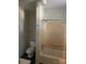 Standard bathroom with a shower-tub combination and scale-patterned wallpaper at 500 W Council St, Salisbury, NC 28144