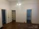Bedroom with hardwood floors and multiple entrances to the walk-in closet and bathroom at 500 W Council St, Salisbury, NC 28144