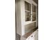 Vintage cabinet featuring glass paneling and a rustic wooden base at 500 W Council St, Salisbury, NC 28144