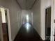 Spacious hallway with hardwood floors and traditional wainscoting, leading to various rooms at 500 W Council St, Salisbury, NC 28144
