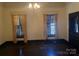 Sunlit living room with hardwood floors and classic window treatments at 500 W Council St, Salisbury, NC 28144