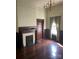 Living room featuring an ornate fireplace, hardwood floors, and natural light at 500 W Council St, Salisbury, NC 28144