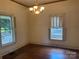 Sunlit living room with hardwood floors and traditional window shutters at 500 W Council St, Salisbury, NC 28144