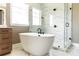 Modern bathroom featuring soaking tub, glass enclosed shower with beautiful tile at 503 Meadow Ridge Dr, Belmont, NC 28012