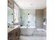 Modern bathroom featuring soaking tub, glass enclosed shower with beautiful tile at 503 Meadow Ridge Dr, Belmont, NC 28012