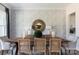 Elegant dining room featuring stylish wallpaper, striking mirror, and seating for six at 503 Meadow Ridge Dr, Belmont, NC 28012