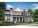 Charming two-story home featuring a welcoming front porch, complemented by manicured landscaping and a classic design at 503 Meadow Ridge Dr, Belmont, NC 28012