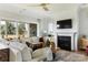 Bright living room with cozy seating, fireplace, and seamless outdoor access at 503 Meadow Ridge Dr, Belmont, NC 28012