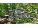 Scenic backyard featuring a large deck, verdant lawn, and charming pergola, perfect for outdoor gatherings at 7357 Elwood Dr, Charlotte, NC 28227