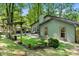 Landscaped backyard featuring a pergola, patio area and well-maintained greenery at 7357 Elwood Dr, Charlotte, NC 28227