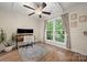 Cozy bedroom with natural light, wood floors, a ceiling fan, and neutral decor at 7357 Elwood Dr, Charlotte, NC 28227