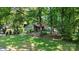 Charming home with well-manicured front lawn and mature trees, offering a welcoming curb appeal at 7357 Elwood Dr, Charlotte, NC 28227