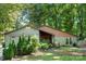 Well-maintained single story house featuring a green lawn and complemented by mature trees at 7357 Elwood Dr, Charlotte, NC 28227