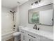 Bathroom featuring updated vanity, modern fixtures, and shower-tub combination at 7525 Cedarbrook Dr, Charlotte, NC 28215