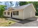 A beautiful single story home with a well-manicured front yard and black shutters at 7525 Cedarbrook Dr, Charlotte, NC 28215
