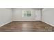Inviting room with fresh paint, updated floors and plenty of natural light at 7525 Cedarbrook Dr, Charlotte, NC 28215