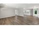 Open concept living space with updated floors and fresh paint at 7525 Cedarbrook Dr, Charlotte, NC 28215