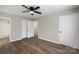 Spacious main bedroom with a ceiling fan, and closet and bathroom access at 7525 Cedarbrook Dr, Charlotte, NC 28215