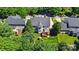 Aerial view of home featuring lush backyard with play area and a spacious deck at 7722 Garnkirk Dr, Huntersville, NC 28078