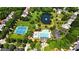 Aerial shot featuring a community pool, tennis courts, clubhouse, and a tranquil pond with fountain at 7722 Garnkirk Dr, Huntersville, NC 28078
