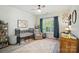Bedroom features a crib, neutral decor, ceiling fan, and natural light at 7722 Garnkirk Dr, Huntersville, NC 28078