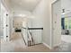 Bright hallway with neutral decor, leads to bedrooms and overlooks the staircase at 7722 Garnkirk Dr, Huntersville, NC 28078
