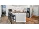 The kitchen includes stainless steel appliances, and a breakfast bar at 7722 Garnkirk Dr, Huntersville, NC 28078