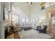Bright living room boasts a fireplace, high ceilings, and a comfortable seating area at 7722 Garnkirk Dr, Huntersville, NC 28078