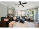 Spacious living room offering comfortable furniture, large windows, and a relaxing ambiance at 7722 Garnkirk Dr, Huntersville, NC 28078