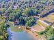 Overhead shot featuring lake frontage, multiple docks, and verdant tree coverage offering privacy and scenic water views at 7733 Skyline Dr, Sherrills Ford, NC 28673
