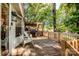 Exterior deck showcasing outdoor seating and wooded views for relaxing and entertaining at 7733 Skyline Dr, Sherrills Ford, NC 28673