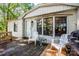 Relaxing outdoor deck with chairs, table, and picturesque views of the surrounding nature at 7733 Skyline Dr, Sherrills Ford, NC 28673