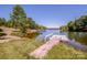 Inviting waterfront view showcasing a wooden dock extending into the tranquil lake at 7733 Skyline Dr, Sherrills Ford, NC 28673