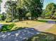 Charming home nestled on a well-maintained lot, surrounded by mature trees and lush greenery at 7733 Skyline Dr, Sherrills Ford, NC 28673
