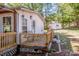 Exterior view of a house featuring a wooden deck and landscaping around a serene backyard at 7733 Skyline Dr, Sherrills Ford, NC 28673